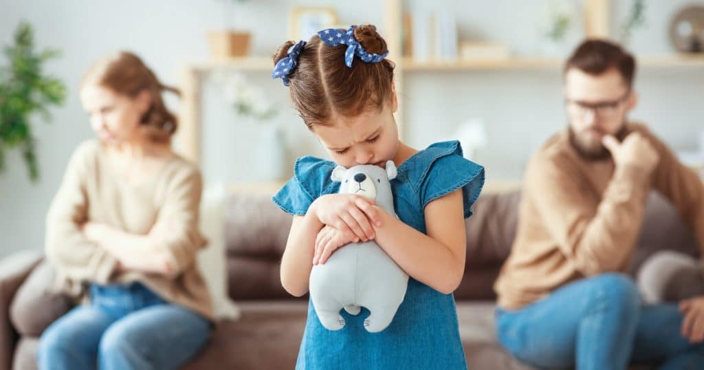 Parents fighting an a child hugging her toy https://www.autismparentingmagazine.com/autism-and-divorce/